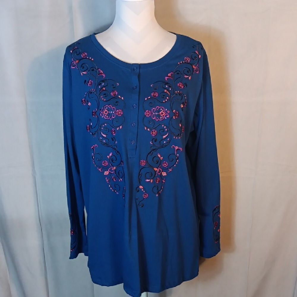 Woman Within Blue Blouse with Pink Embroidery